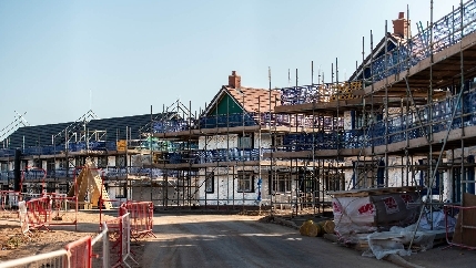 A housing construction site. A new build warrant will protect buying of new build properties against any problems caused by the construction process.

